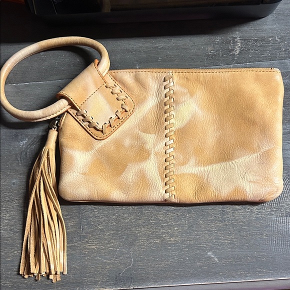 Hobo Sable Wristlet in Saffron, featuring genuine leather, wrist handle, tassel